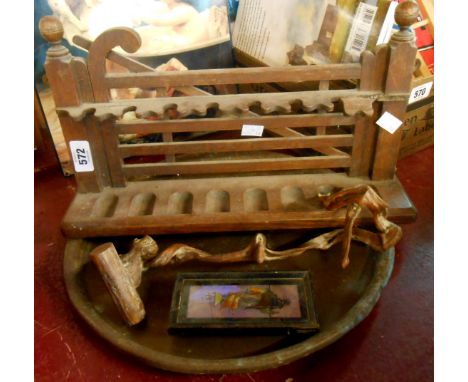 A brass tray, a wooden gate pattern pipe rack, butterfly wing picture, and a treen sculpture