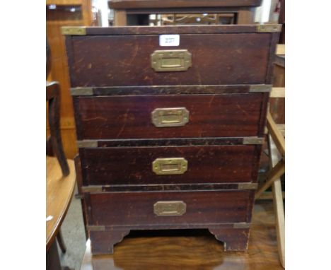 A 46cm 20th Century reproduction stained wood campaign style chest of four long drawers with brass bound corners and flanking
