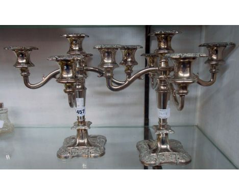 A pair of 20th Century silver plated four branch, five light candelabra
