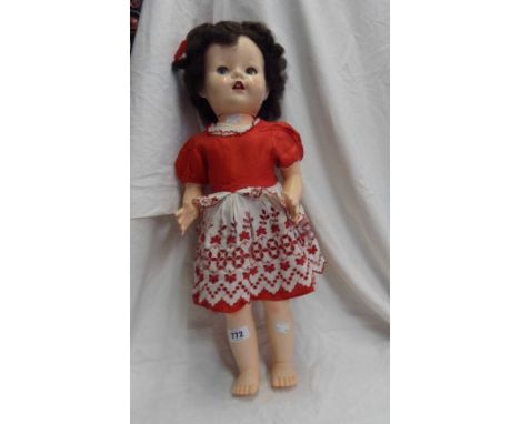 A vintage English doll with original clothing