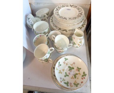 A Wedgwood Wild Strawberry and Strawberry Hill pattern part dinner and tea service including plates, cups and saucers, etc.