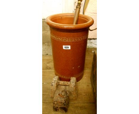 A saltglaze stoneware stick stand, garden spray, and two cast iron weights