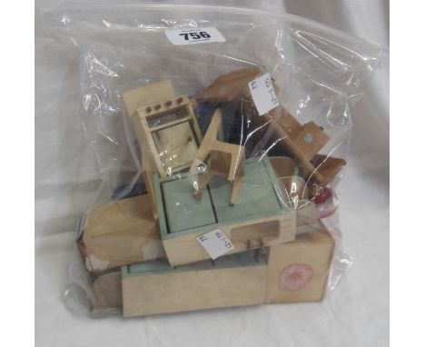 A quantity of vintage wooden dolls house furniture