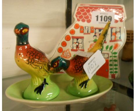 A Carltonware pheasant cruet and stand, and Old Lady who Lived in a Shoe money box