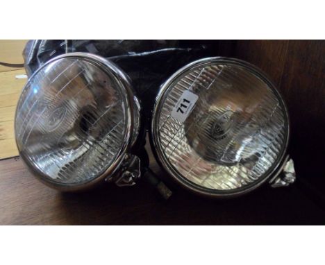 A pair of vintage CAV V.S.107 car headlights