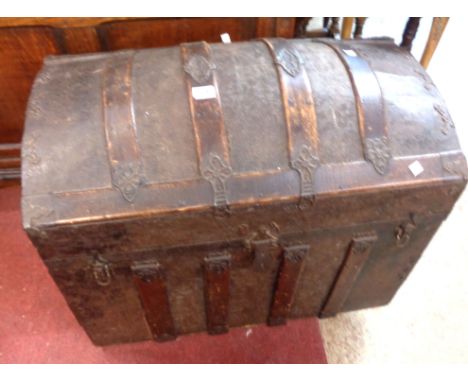An 83cm late 19th Century bentwood and pressed metal bound dome-top travelling trunk - missing interior tray and flanking lea