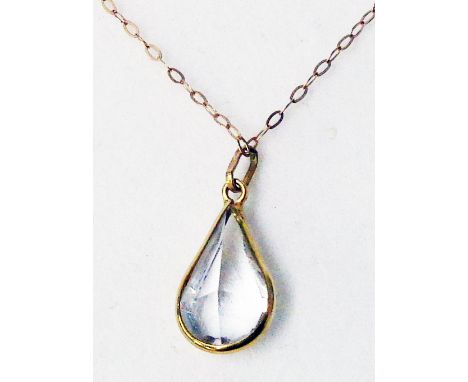 A 9ct. gold white stone drop pendant on fine 9K chain