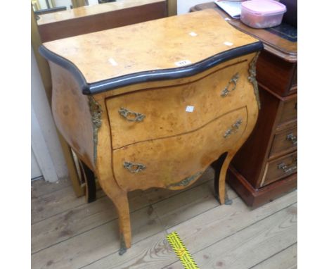 A 63cm reproduction bird's-eye maple and part ebonised bombe commode chest of two long drawers with applied cast brass decora