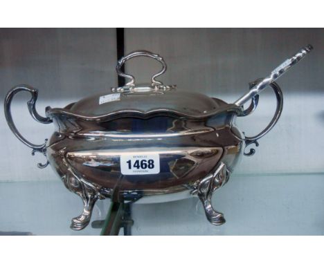 A silver plated soup tureen and associated ladle