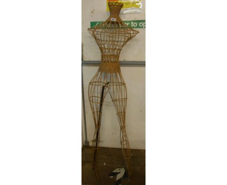 A vintage wicker and wire female mannequin