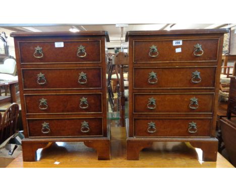 A pair of 43cm reproduction figured walnut bedside chests of four drawers, set on bracket feet - a/f