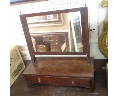 A 19th Century mahogany platform dressing table mirror with flanking reeded supports and two short drawers under, set on brac