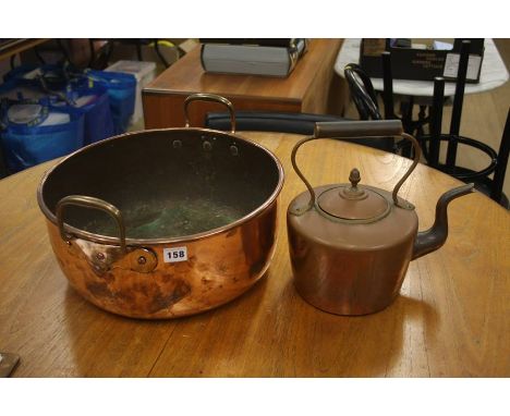 A large copper pot and kettle