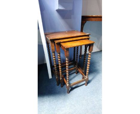 An oak bobbin turned nest of tables