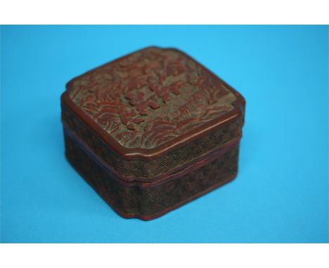 A Cinnabar lacquer box, carved with children playing 9.5 cm wide