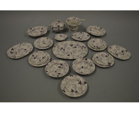 A PURPLE TRANSFER PRINTED FLORAL DECORATED PART CHILDS DOLLS HOUSE DINNER SERVICE, comprising tureen, plates, meat plates, la