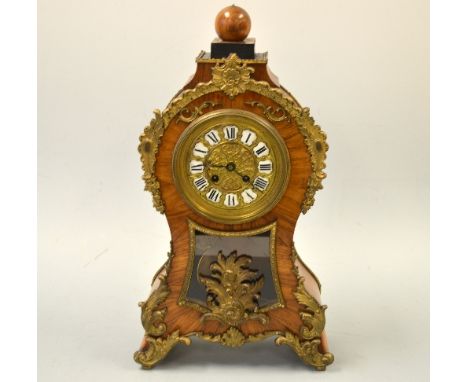 A FRENCH LOUIS XV STYLE VENEERED MANTEL CLOCK, with gilt dial with individual shaped enamelled Roman numerals plaques, ormolu