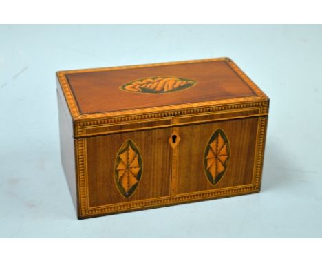A MAHOGANY INLAID TEA CADDY, with geometric banded borders and shell inlay to hinged lid and two front panels, approximately 