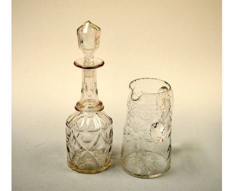 A CUT GLASS TAPERING WATER JUG, with flower decoration, together with mallet decanter and stopper, approximately 20cm and 33.