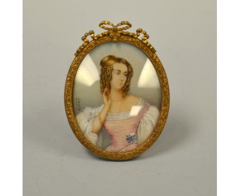 AN OVAL PORTRAIT MINIATURE, depicting young woman with jewellery, signed N Barelay and A Krauff set in oval gilt easel frame 