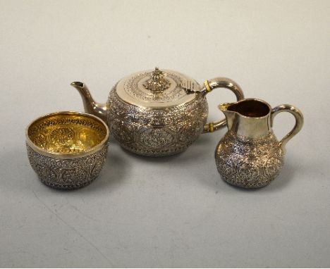 A SILVER THREE PIECE BATCHELORS TEASET, with engraved swag and foliate design, teapot with urn finial, lion and shield cartou