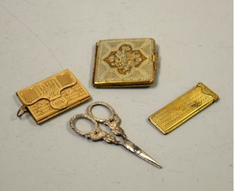 THREE BRASS VICTORIAN NEEDLE CASES, embossed floral example, Patent Perry & Co London star engraved and engine turned envelop