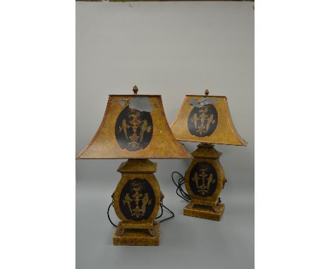 A PAIR OF TOLEWARE LAMPS, of ovoid form with central black cartouche depicting parrots on branch with flowers matching design