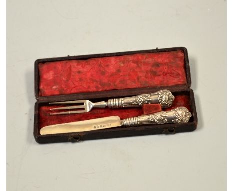 A CASED MINIATURE SILVER TRAVELLING KNIFE AND FORK, with embossed floral and shell handles, Birmingham 1843?