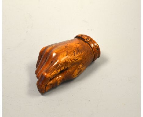 A 19TH CENTURY CARVED TREEN TABLE SNUFF BOX, in the form of closed hand with bracelet, approximately 12cm long maximum