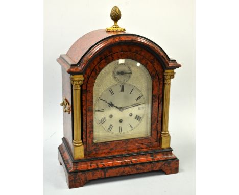A LACQURED TORTOISESHELL EFFECT BRACKET CLOCK, with dome top on bracket feet, silvered dial with engraved floral and scroll d