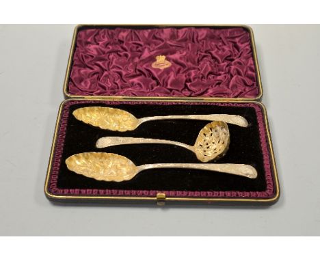 A CASED SILVER STRAWBERRY SET, comprising two berry spoons with embossed bird design and sifter spoon with shaped pierced bow