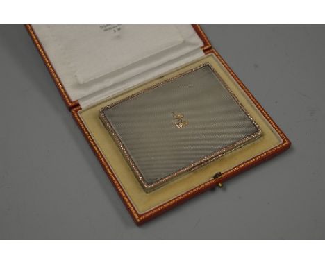 A CASED SILVER PRESENTATION BOX, engine turned with gilt border and bird mount to hinged lid, the interior engraved 'Macbeth 