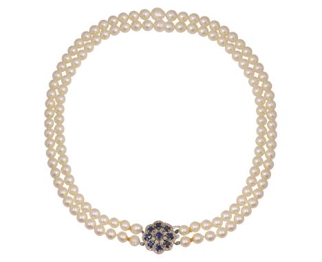 A two row cultured pearl necklace with gem-set cluster clasp, the slightly graduated  cultured pearls measuring 9mm-7mm in di