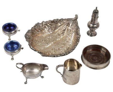 A collection of George II, George III and later silver to include a pair of salts,a bottle coaster, a pepper caster and a cre