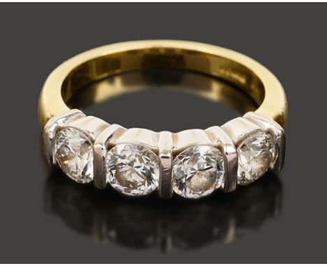 A diamond four stone ring, each brilliant-cut diamond separated by a white  gold bar, to the 18ct yellow gold  tapering shank