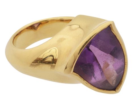 A stylish Modern amethyst and 18ct yellow Modernist ringthe shaped triangular buff top amethyst  set within the  asymmetric h