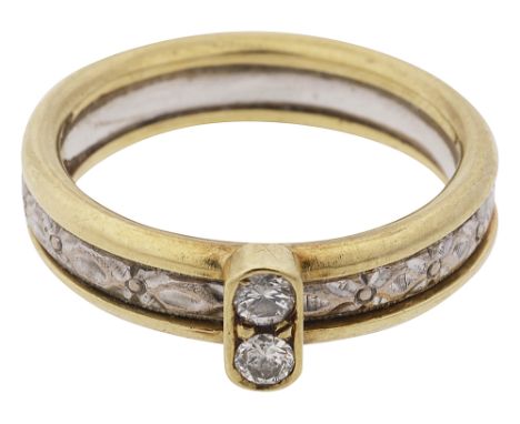 A diamond-set band ring,the two brilliant-cut diamonds set within a collett and applied to the two coloured engraved band sta