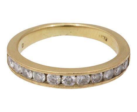 A half hoop eternity ringthe top section channel-set with eleven brilliant-cut diamonds, hallmark rubbedring size K1/2, 3.1gC