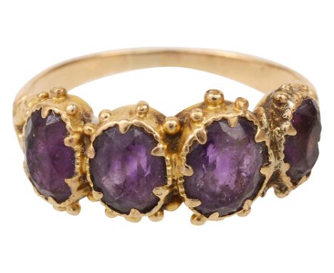 An amethyst four stone ring,each graduated oval amethyst collet-set applied with spherical beadworkring size M, 2.8gCondition