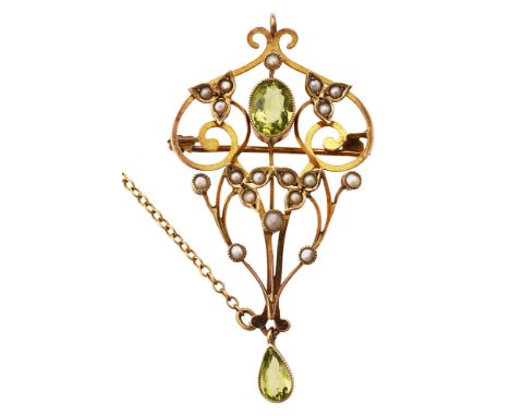 An Edwardian 9ct gold peridot and seed pearl broochthe openwork brooch with scroll work design, with central oval collet-set 