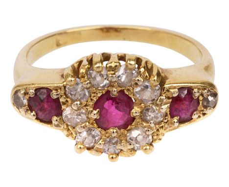 A ruby and diamond-set ring, the central ruby and old brilliant-cut cluster flanked to either side by an oval cut ruby and an