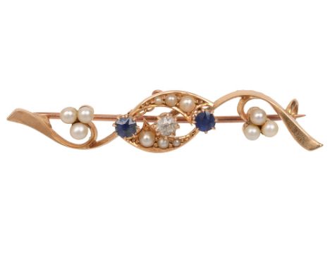 An Edwardian 15ct yellow gold, pearl and gem-set bar brooch, of openwork scrolling design and centrally-set with an old brill