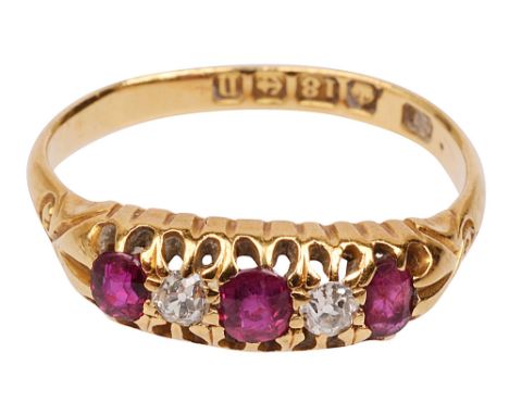 An early 20th century ruby and diamond five stone ringthe three circular-cut rubies each separated by an old brilliant-cut di