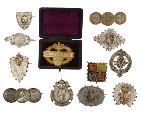 A collection of mostly silver and enamel Queen Victoria 1887 Golden Jubilee commemorative brooches to include a horseshoe, sh