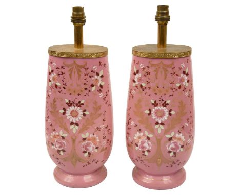 A pair of 19th century French pink opaline glass vases, converted to table lamps, enamelled with flowers and scrolls in pink 