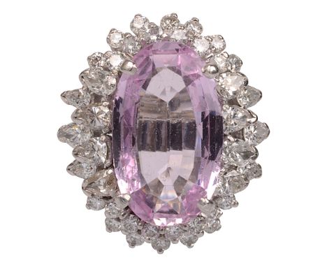 A pink topaz and diamond cluster ringthe oval pink topaz set above two tiers of groups of pear-shaped and circular brilliant-