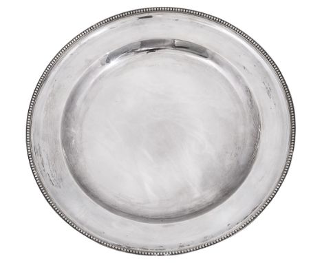 A late Victorian silver dinner plateLondon, 1899 by William Comynsof plain circular form with beaded bordersdiameter 24 cm., 