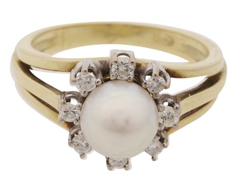 A cultured pearl and diamond set ring,the central cultured pearl measuring 8.5mm in diameter to the surround of eight brillia