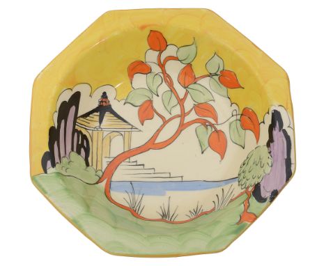 A Clarice Cliff 'Yellow Japan' octagonal dishwith stylised garden scene and pagoda in the background beneath a yellow sky, pr