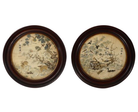 A pair of 19th century Chinese embroidered roundels/ panels, finely embroidered in silk, primarily in blue, gold, brown and p